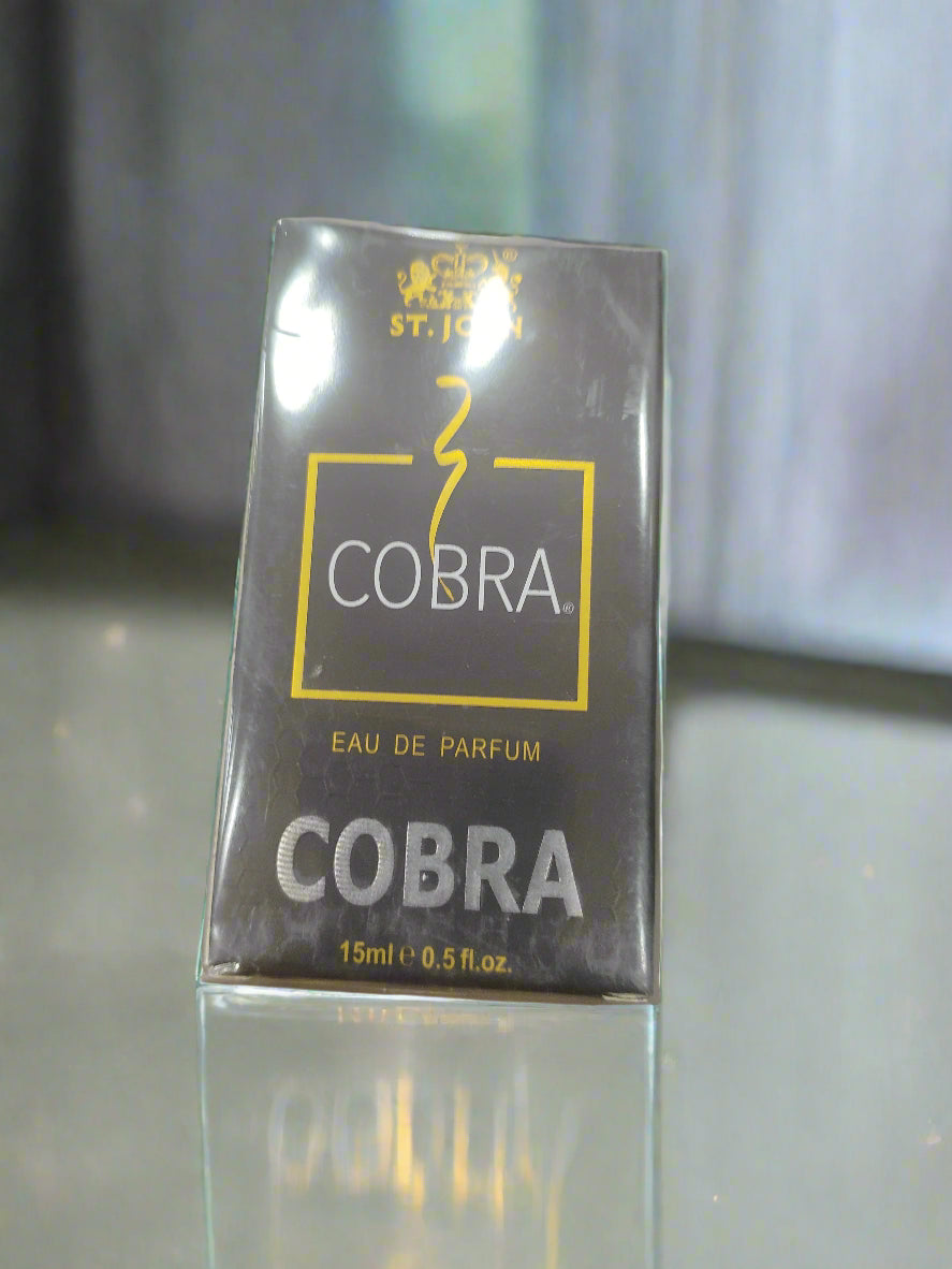 Cobra perfume packaging on a marble surface